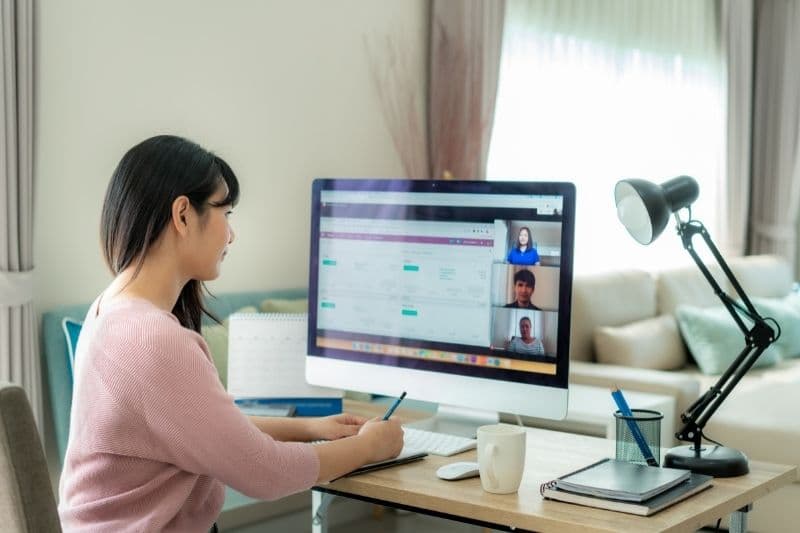 Woman at computer working in an Learning Management System (LMS)